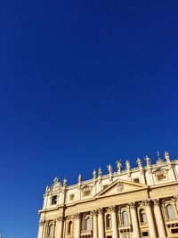 Low angle view of building against blue sky