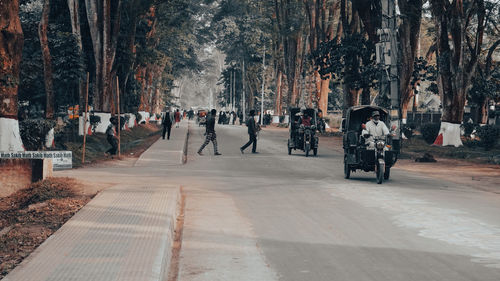 People walking at paris road, rajshahi university