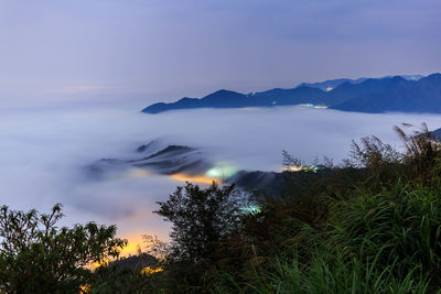 Scenic view of tree mountains against sky