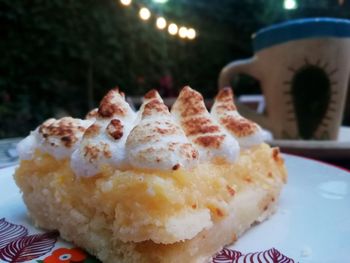 Close-up of cake served on table