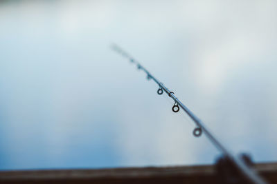 Close-up of water drop against sky