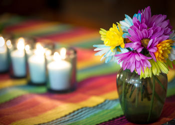 Close-up of yellow flower vase on table