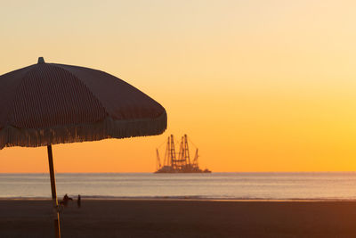 Scenic view of sea against clear sky during sunset