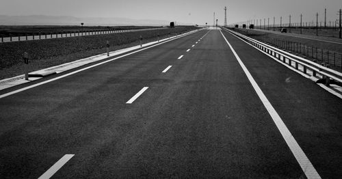 Empty road along highway