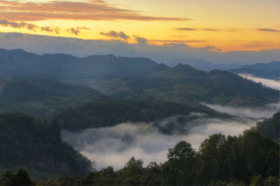 Scenic view of mountains against sky during sunset