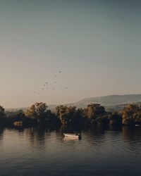 Scenic view of lake against sky during sunset