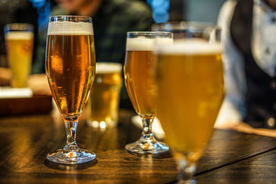 Close-up of beer glass on table