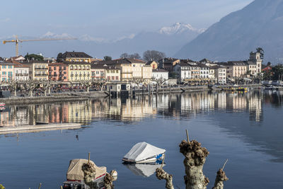 Panoramic view of lake and buildings against sky