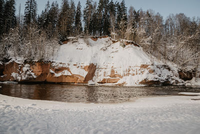 View of frozen lake against sky during winter