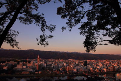 View of cityscape against sky during sunset