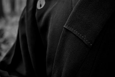 Midsection of man standing in corridor