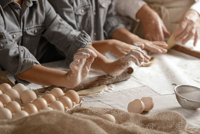 Midsection of man working on table