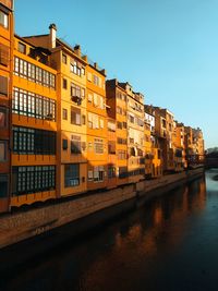 Canal amidst buildings in city