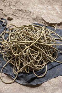 High angle view of ropes tied on floor