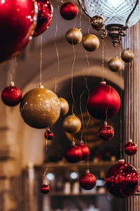 Christmas glass red and golden balls hanging in the interior. new year details and festive