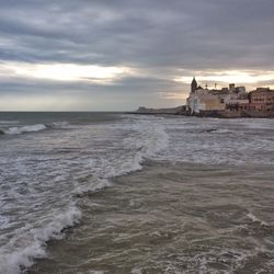 Scenic view of sea against cloudy sky