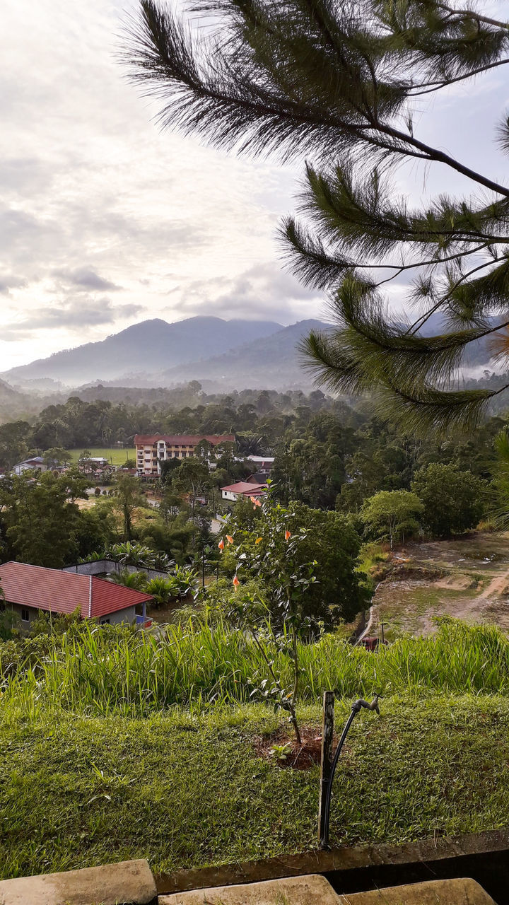 SCENIC VIEW OF LANDSCAPE AND BUILDINGS AGAINST SKY