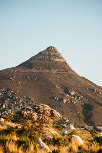 Scenic view of rocky mountains against clear sky