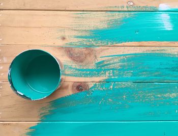 Directly above shot of bucket on turquoise table