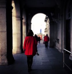 Low angle view of woman standing on railing