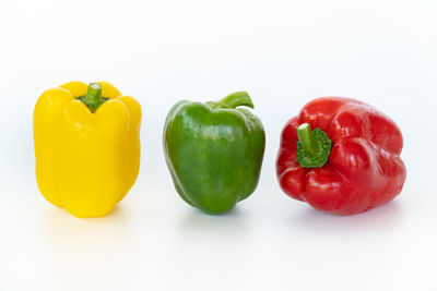 Close-up of bell peppers against white background