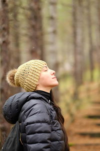 Portrait of young woman wearing hat