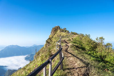 Scenic view of mountains against clear blue sky