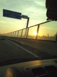 People on road at sunset