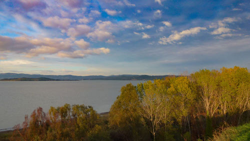 Scenic view of lake against sky during sunset