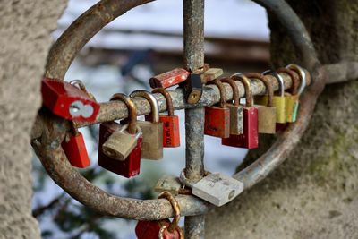 Close-up of padlocks on railing