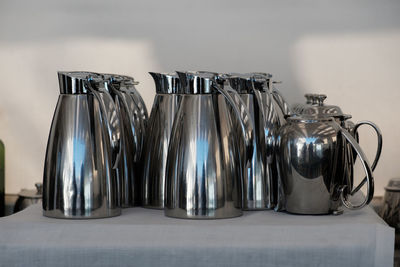 Close-up of wine glasses on table