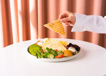 Traditional breakfast with bacon, avocado and toasts on white table. healthy food concept. close-up