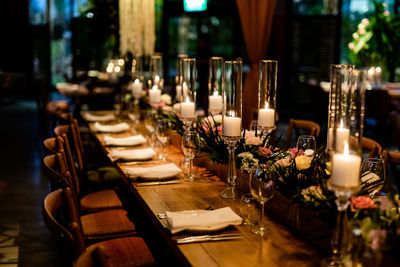 Luxury table settings for fine dining with and glassware, pouring wine to glass.