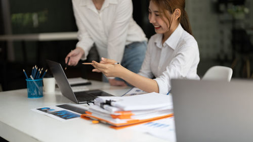 Business colleagues working at desk in office