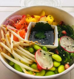 Close-up of chopped fruits in bowl on table