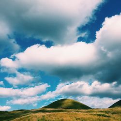 Scenic view of landscape against cloudy sky