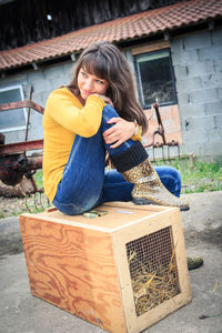 Young woman sitting outdoors