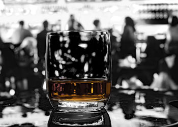 Close-up of beer glass on table