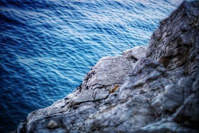 Close-up of rock formation in sea