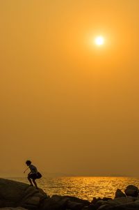 Scenic view of sea at sunset