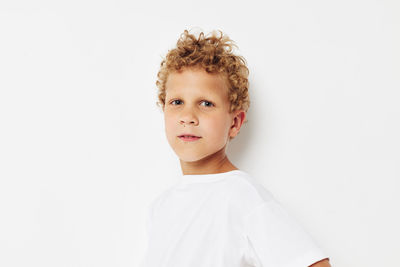 Portrait of cute girl against white background