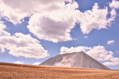 Scenic view of arid landscape against sky