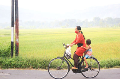 A mother takes her child to school in the morning