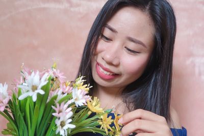 Close-up portrait of a smiling young woman