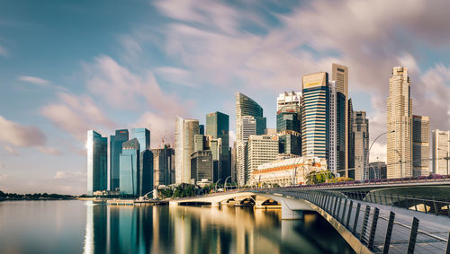 View of skyscrapers against cloudy sky