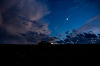 Silhouette landscape against sky during sunset