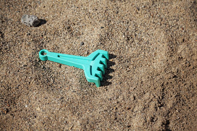 High angle view of toy on sand