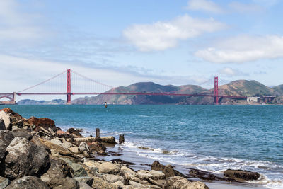 View of suspension bridge over sea