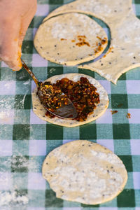 Cropped image of person preparing food on table