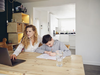 Friends sitting on table